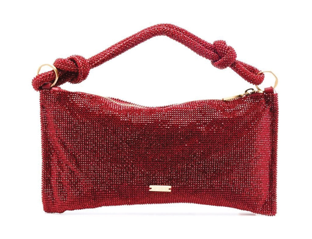 Cult Gaia’s “Hera Gem” clutch bag, embellished with red crystals, will hold all of your holiday essentials in style. Available at MJH Studios in Del Mar